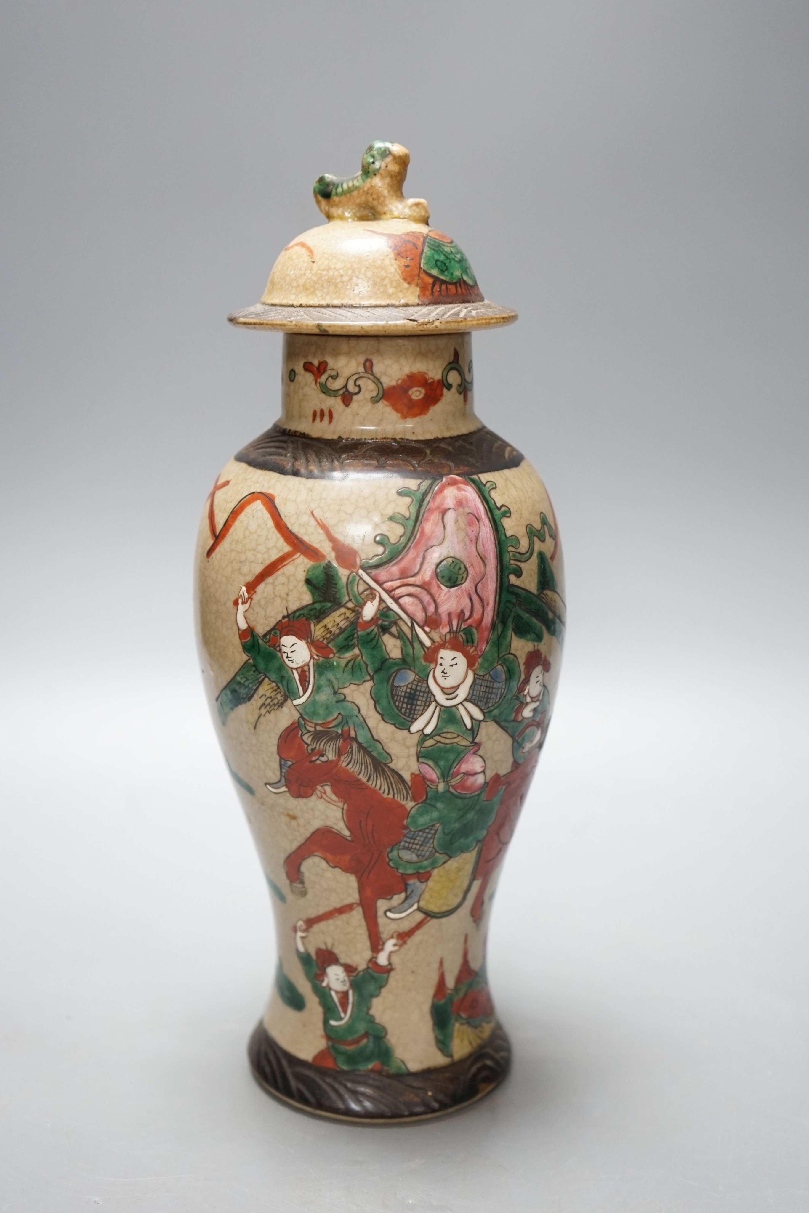 A late 19th century Chinese crackle glaze famille rose baluster vase and cover 30cm